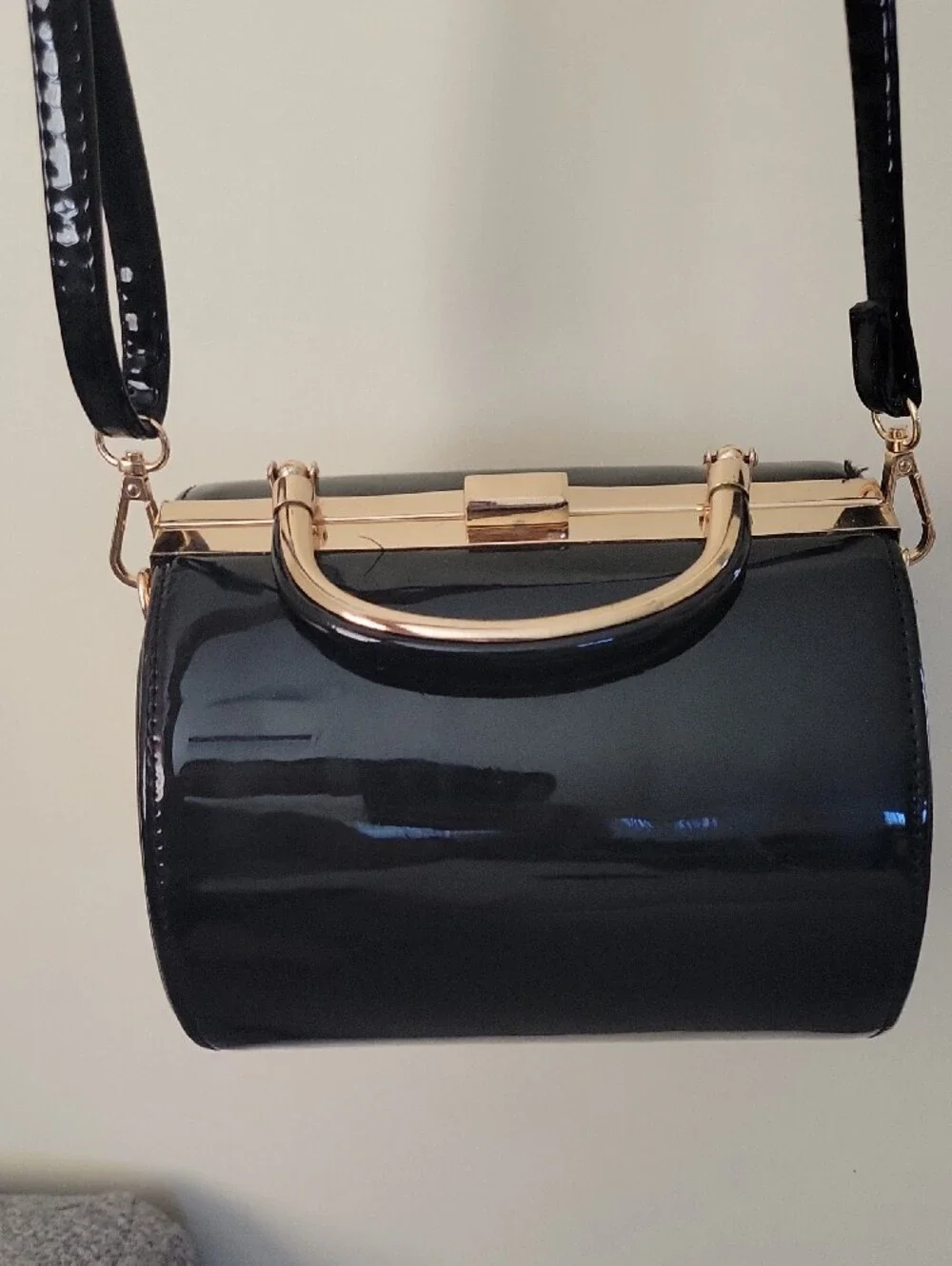 Vintage Sleek Black Patent Barrel Crossbody Bag with Gold Hardware